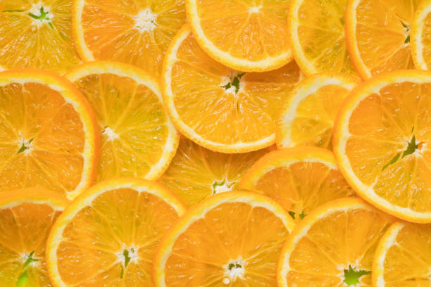 istock Juicy ripe slices oranges background 1071985864