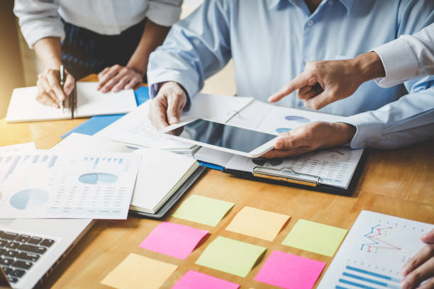 istock Co working conference, Business team meeting present discussing working analysis with financial data and marketing growth report graph in team, Finance, accounting, investment 1071990694