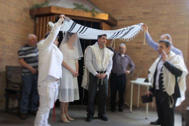 Jewish bride and a bridegroom wedding Ceremony Jewish bride and a bridegroom married in a modern Orthodox Jewish wedding ceremony in a synagog. rabbi photos stock pictures, royalty-free photos & images