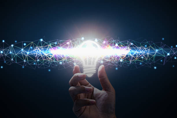 istock Business idea. Men hand holding light bulb. Polygon color line 1071996826