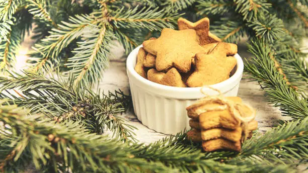 Gingerbread Cookie. Small stars. New Year. Fir branch.