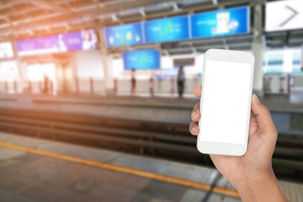 istock Hand holding smartphone with transportation urban 1072005210