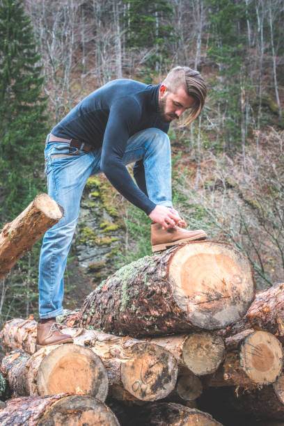 istock Man tie shoes in the forest 1072021222
