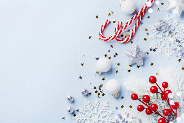 istock Christmas card or banner. Christmas silver decorations on blue background. 1072023792