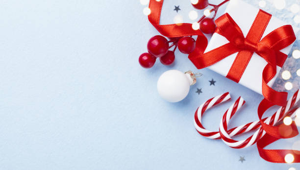 istock Christmas card or banner. Christmas gift box and decorations on blue background. 1072023826