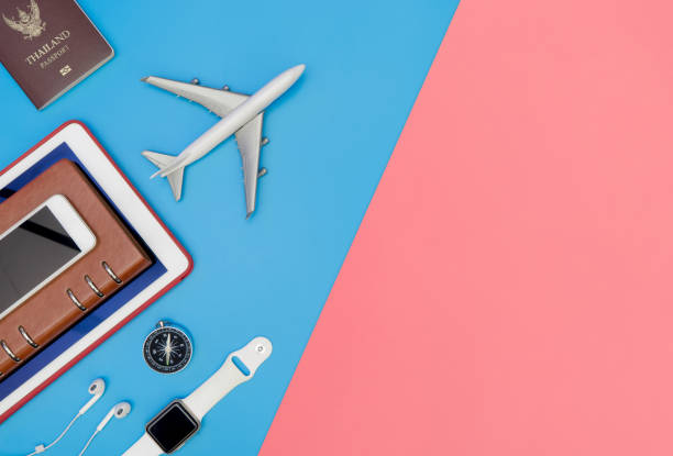 istock Travel top view accessories objects for traveler on blue and pink 1072034224