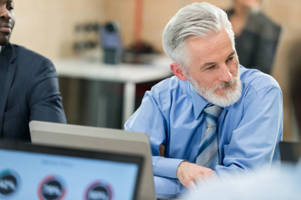istock Business People Using Laptop In Conference Room 1072034286