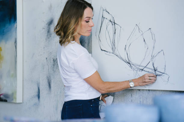 istock Female artist drawing with charcoal 1072036212