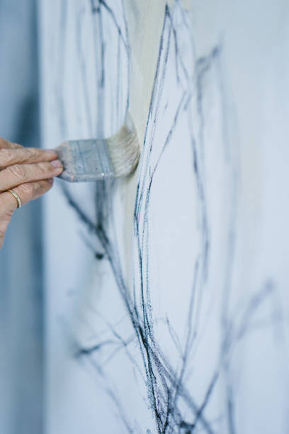 istock Woman painting canvas in art studio 1072038038