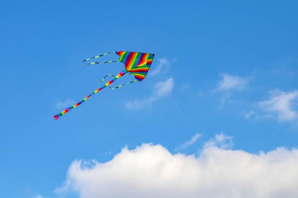 istock Colorful kite flying in the blue sky with wind. 1072038496