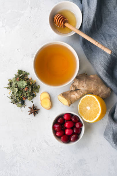 Herbal tea and lemon, ginger, honey.  Vertical photo.
