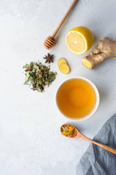 istock Herbal tea and lemon, ginger, honey.  Vertical photo. 1072044860