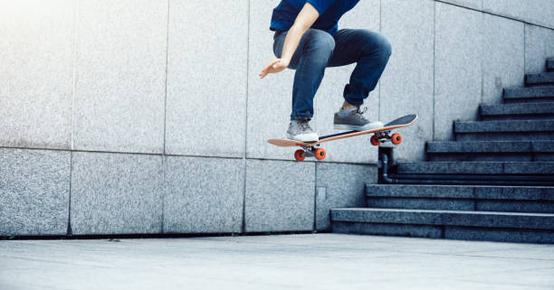 istock Skateboarder doing ollie at city 1072051088