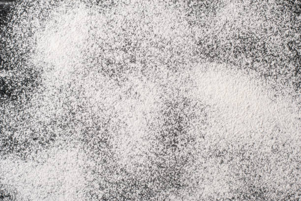istock texture of white flour on a black background 1072052248