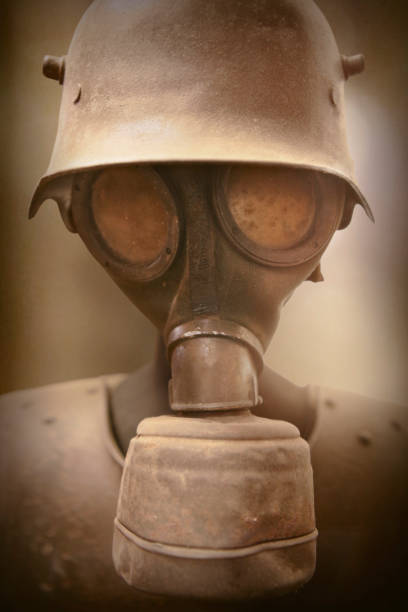 Close up on soldier wearing gas mask in greenish atmosphere