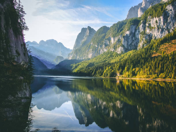 istock mountain summit reflecting in crystal clear lake 1072061606