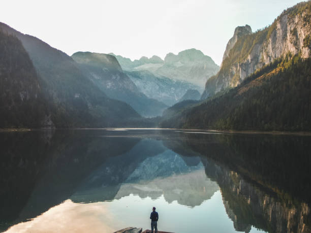 istock mountain summit reflecting in crystal clear lake 1072061608