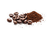 Coffee beans and ground coffee heap isolated on white background