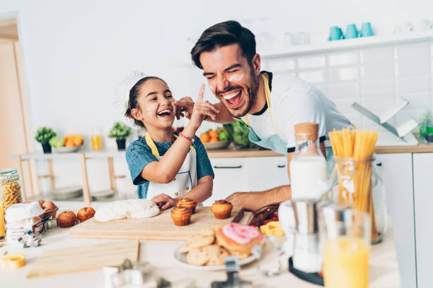 istock Father and daughter getting messy on the kitchen 1072070580