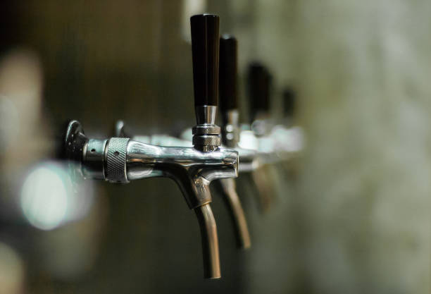 istock craft beer tap on wall 1072071750