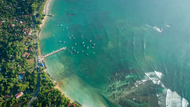 Beautiful aerial view of tropical coastline and fishman village