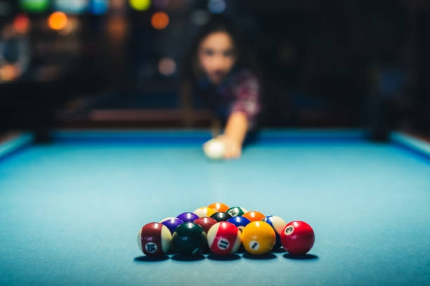 Just before pool break Young attractive brunette woman is playing billiards pool game. pool break stock pictures, royalty-free photos & images