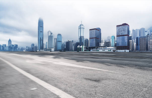 istock Panoramic skyline and buildings with empty road in Hong Kong 1072072036