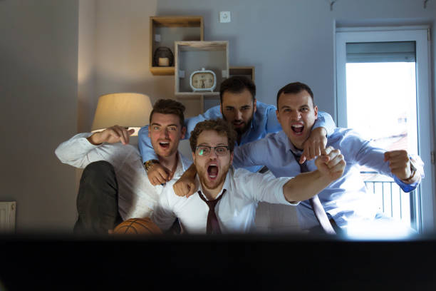 istock Group of friends watching tv after work 1072073810