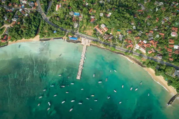 Beautiful aerial view of tropical coastline and fishman village