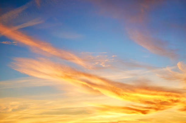 istock Multi-colored porous clouds at sunset with blue sky. Dramatic sky. 1072074304
