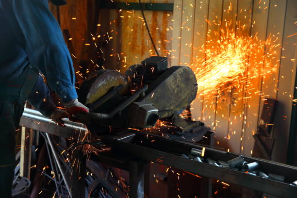 istock Cutting steel with a stationary grinder in a locksmith's workshop. 1072076796