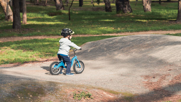istock Kid riding balance bike 1072077148