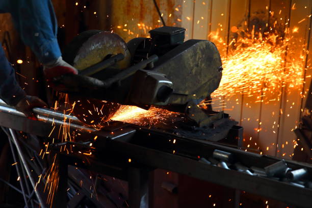 istock Cutting steel with a stationary grinder in a locksmith's workshop. 1072077196