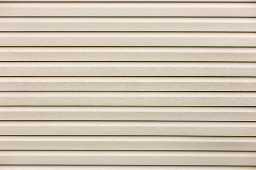 Abstract shiny white flat horizontal surface glamour texture. Vinyl plastic planks, boards siding,copy space background, retro pattern wall. Decoration, construction and repair concept.