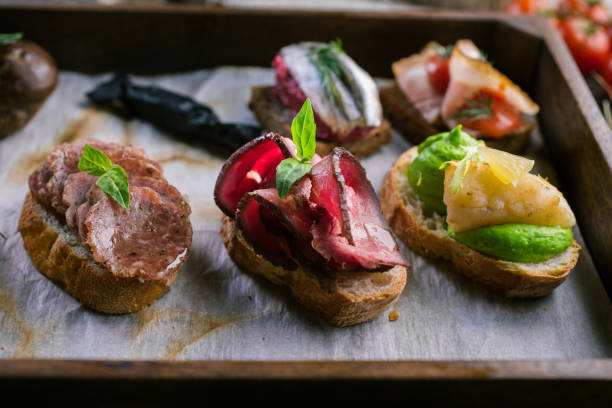 istock Delicious appetizers with Parma, tomatoes and herbs 1072077940