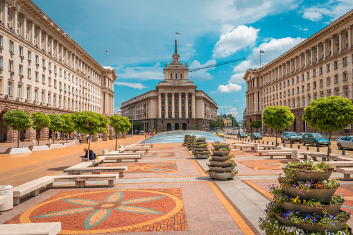 Upward view of European-inspired architecture in Buenos Aires under a clear blue sky.