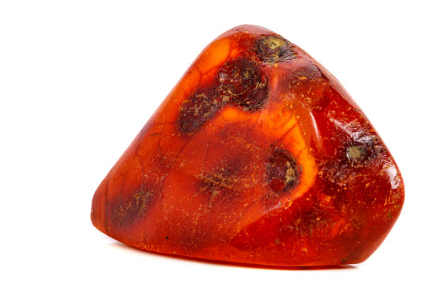 istock Macro Amber mineral stone on white background 1072092144