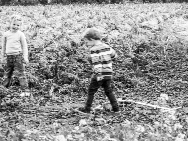 two little boys playing on a field