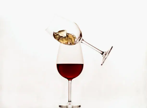 Two glasses with wine on white background, closeup, copy space