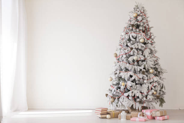 istock Christmas tree white interior room new year gifts holidays 1072099232