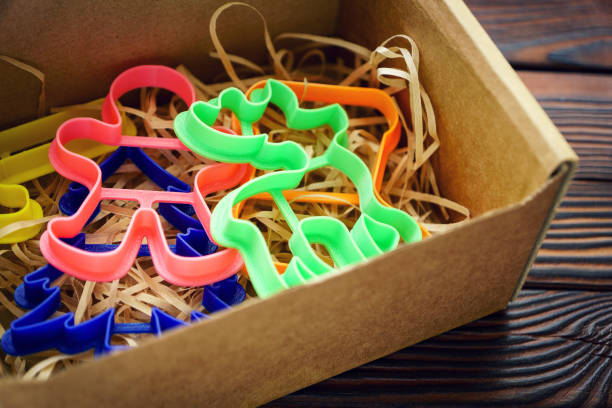 istock Cardboard box with different forms of stamps for gingerbread 1072099562