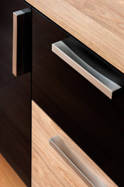 istock Brown chest of drawers in the interior with black glossy elements 1072100418