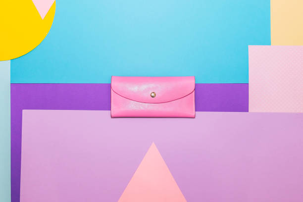 istock Pink leather purse or clutch on memphis style background. 1072108016