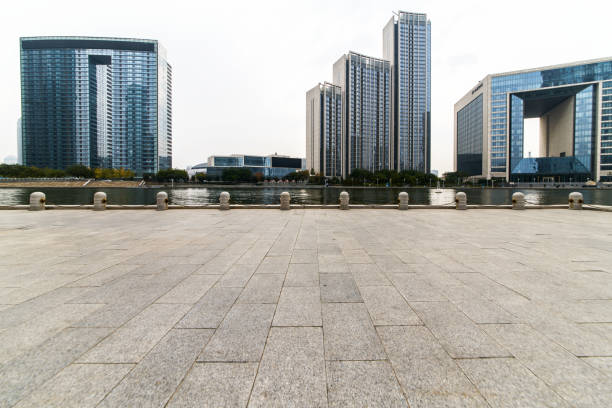empty tiled floor and urban skyline,tianjin china.