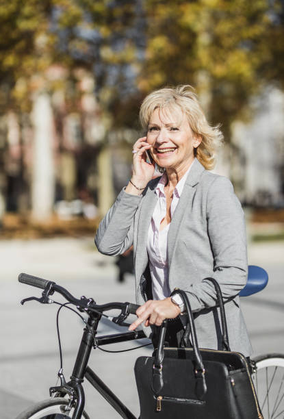 istock Senior Woman Commuting To Work By Bicycle 1072110160