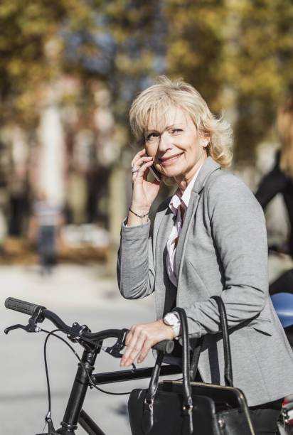 istock Senior Woman Commuting To Work By Bicycle 1072110326