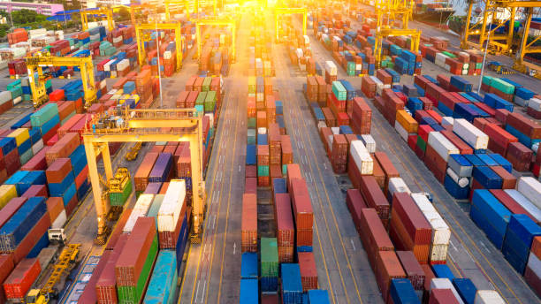 istock Container ship in export and import business and logistics. Shipping cargo to harbor by crane. Water transport International. Aerial view and top view. 1072112902