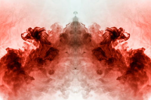 Abstract pattern of colored smoke backlit pink and red in the shape of a mystical-looking bird or a ghost-head  on a white isolated background. Soul and inner state of thoughts.