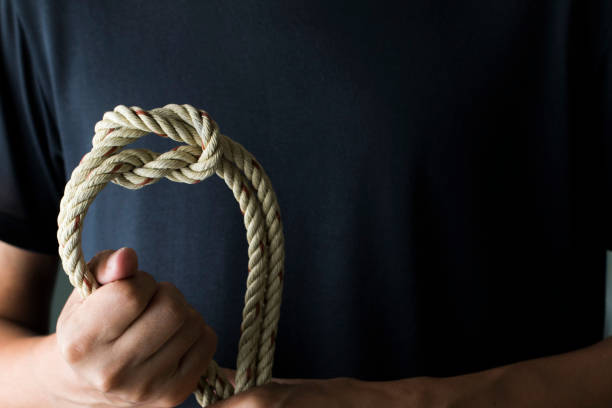 istock Man holding rope with reef knot 1072113852