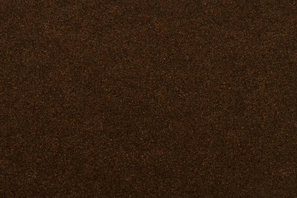 istock dark brown background texture paper metal plastic 1072118128